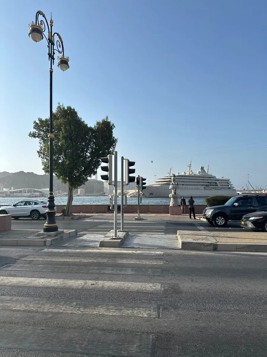 Muscat corniche with ship on the water